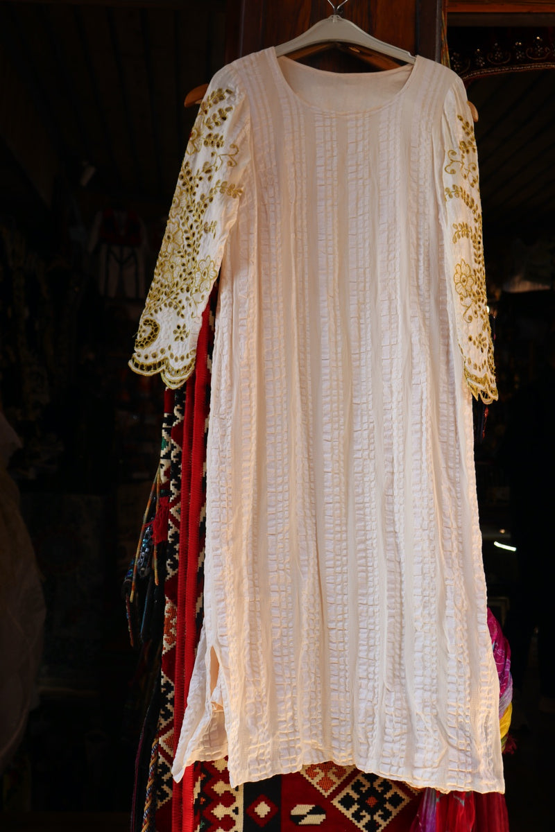 Fabric dress with embroidery and traditional motifs
